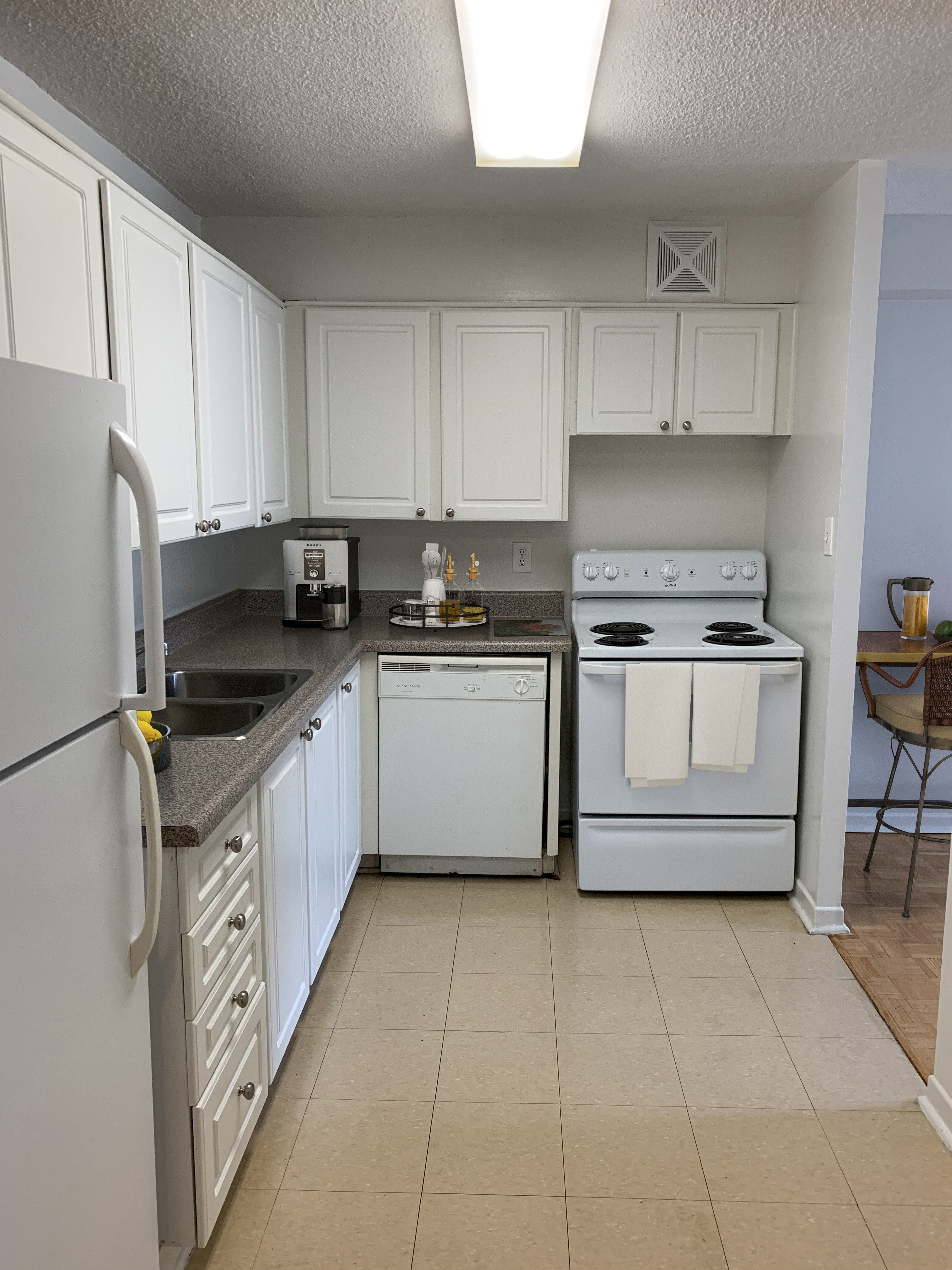 Kitchen with White Cabinets and Appliances