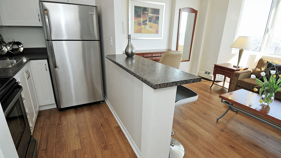 Kitchen With White Cabinets and Stainless Steel Appliances