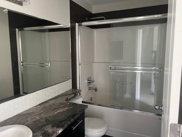 A bathroom with a toilet, sink, and shower.