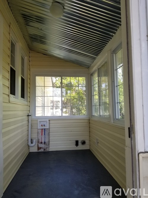 A room with a window and a door.