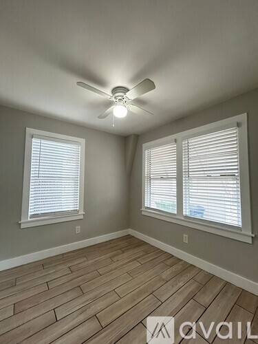 A shower area with tiled walls and floor.