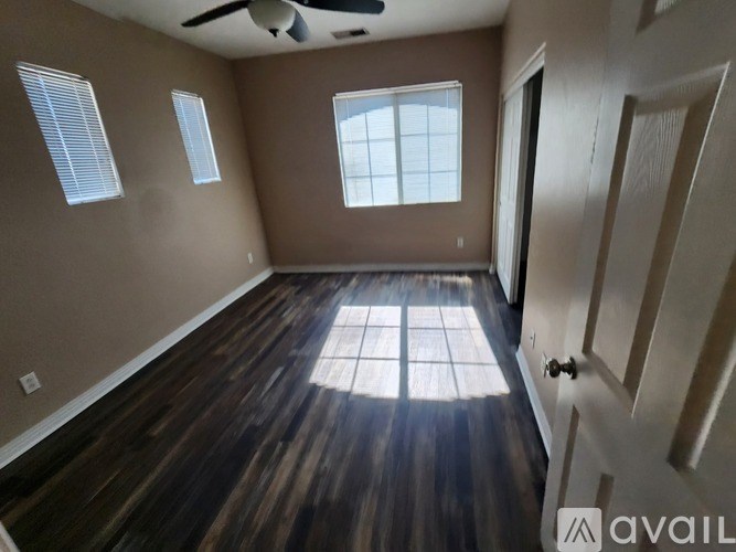 Empty white closet with shelves and a light on the ceiling.