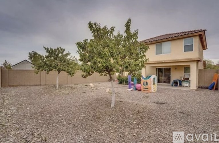 A house with a tree in front of it.