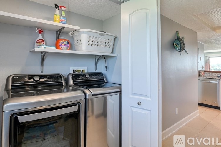 A kitchen with a stainless steel oven and microwave.