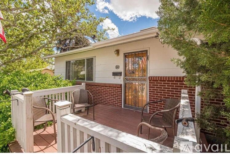 A house with a patio and chairs.