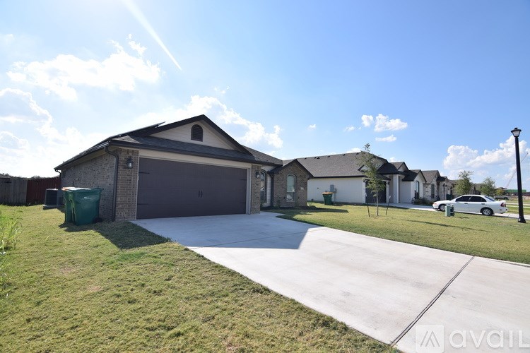 A house with a driveway in front of it.