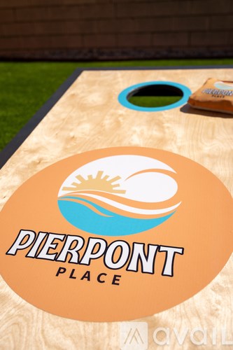 A table with a sticker that says "PIERPONT PLACE" on it.