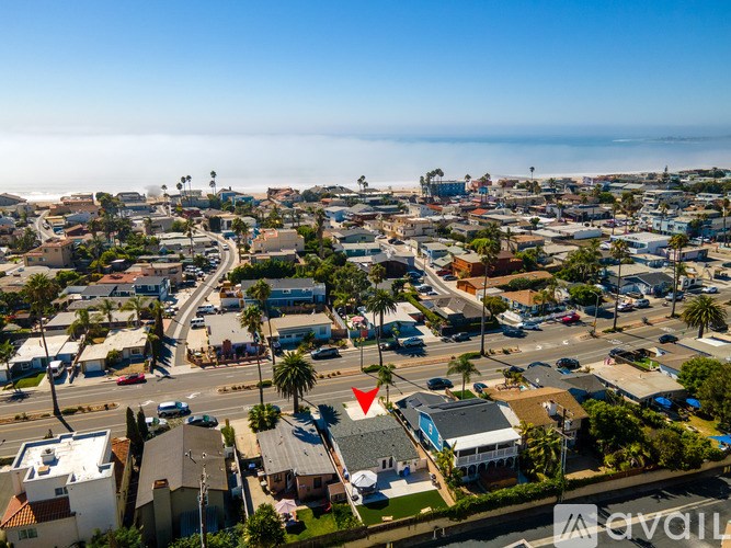 A small town with a lot of trees and a few buildings.