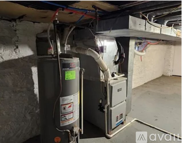 A furnace and air conditioner unit are installed in a basement.
