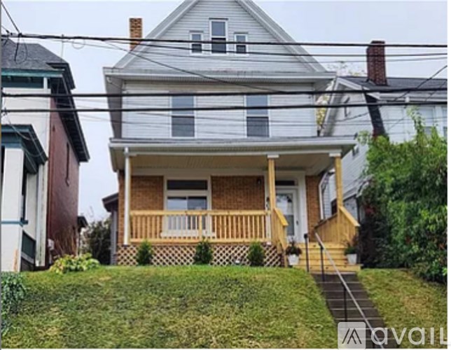 A two-story house with a front porch.