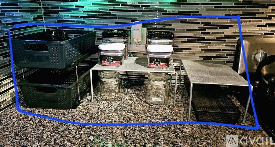 A kitchen counter with a few items on it.