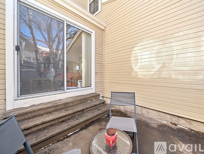 A patio with a table and chairs is shown.
