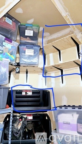 A storage area with containers and tools.