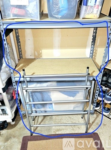 A metal frame with a white sheet of plastic on it.