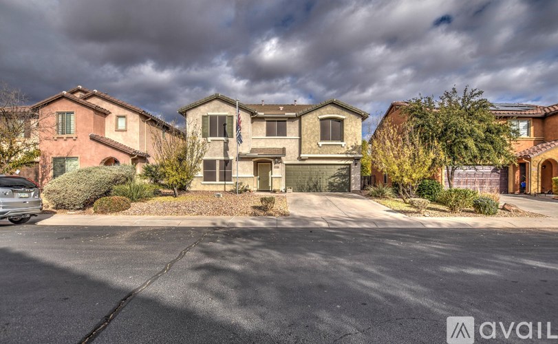 A row of houses with a car parked in front of them.