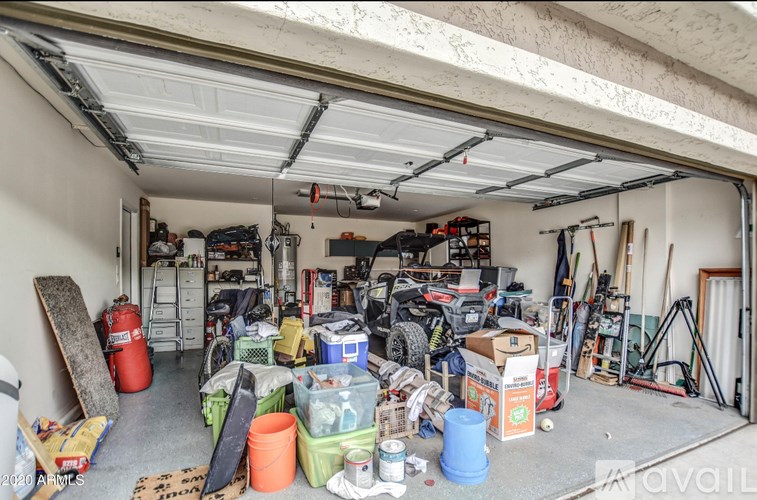 A garage is full of random items and tools.