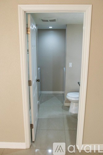 A bathroom with a toilet and a sink.