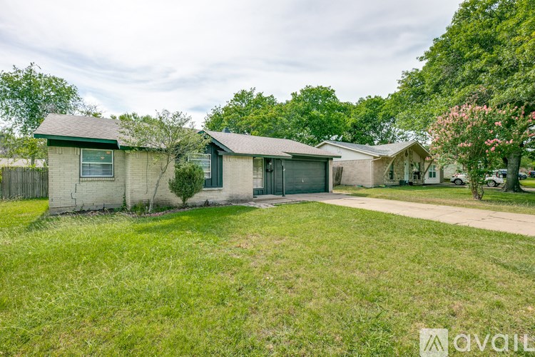 A grassy area in front of a house with a sign that says "available".