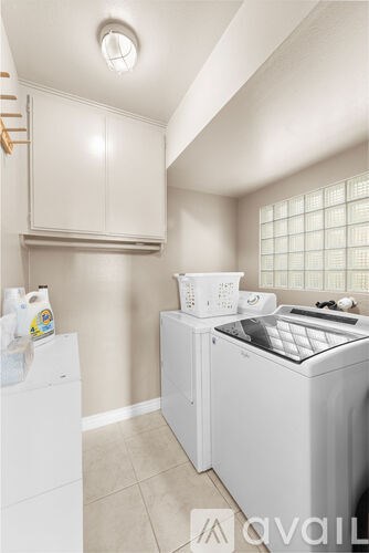 A laundry room with a washer and dryer.