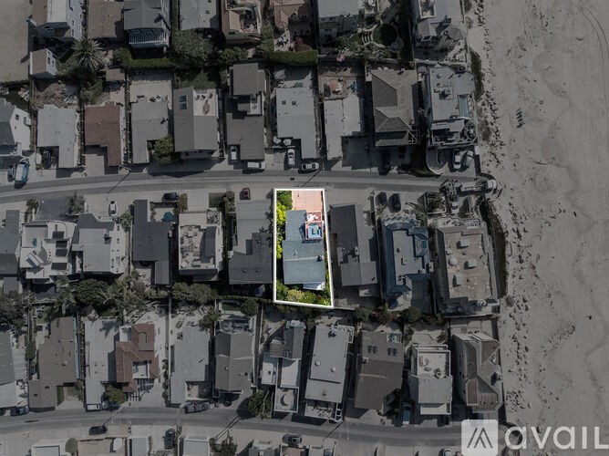 A bird's eye view of a residential area with a highlighted property for sale.