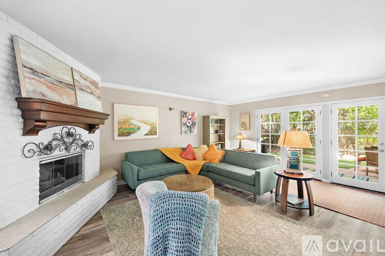 A living room with a fireplace and a couch.