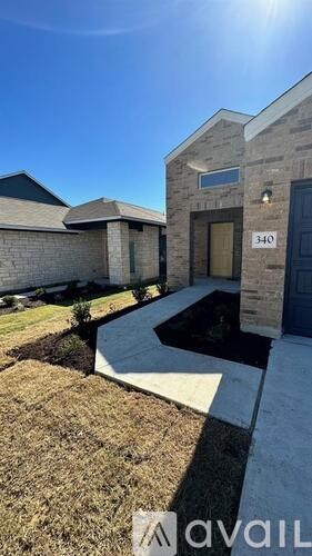 A house numbered 340 is shown with a clear blue sky above.