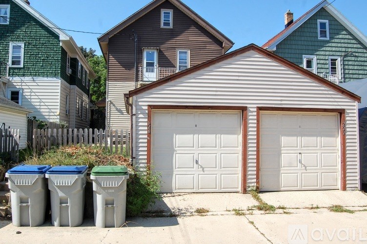A white garage door is on the right.