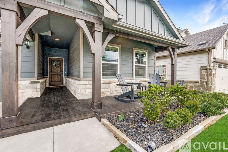 A house with a front porch and a small garden.