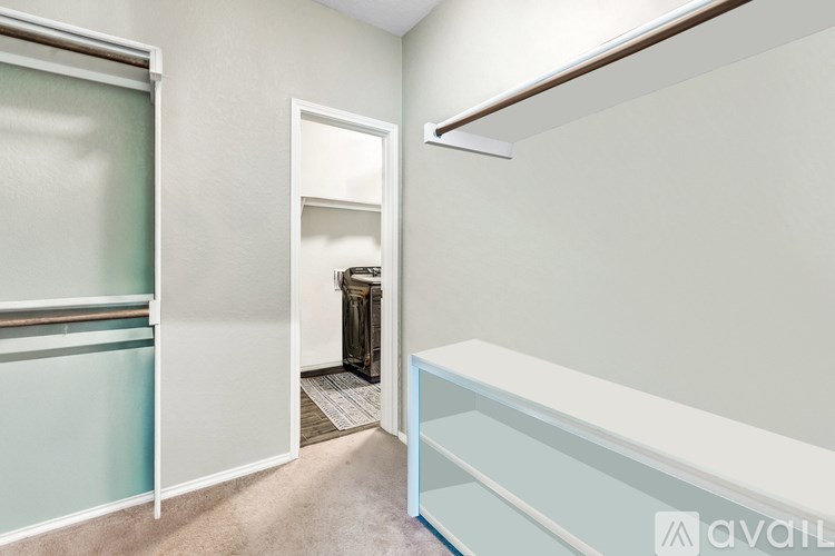 A room with a white door and a window with a white frame.