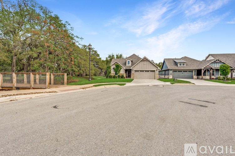 A residential area with houses and a clear sky.