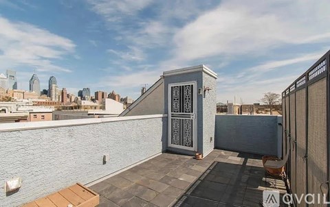 A balcony with a view of a city skyline.