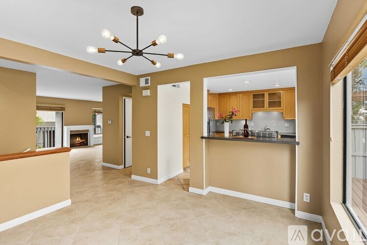 A set of three wooden doors with silver handles.