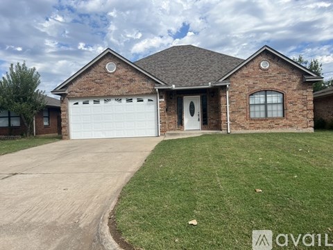 A house with a brick exterior and a white garage door.