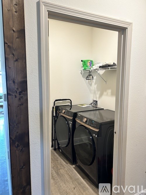 A laundry room with a washer and dryer.
