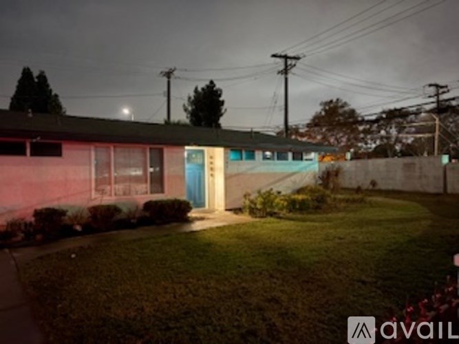 A house with a blue door is available for rent.