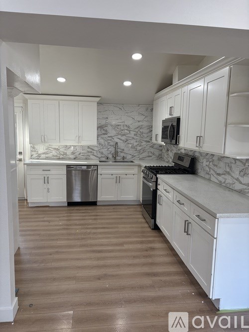 A room with a window and wooden flooring is available for rent.