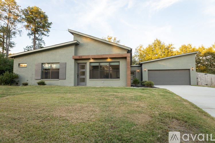 A modern house with a garage is available for sale.