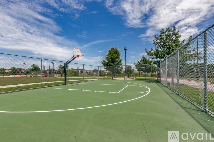 A basketball court with a hoop and a sign that says "available".