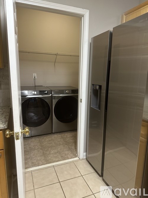 A laundry room with a washer and dryer.
