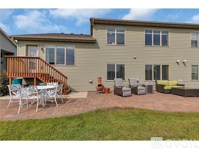 A house with a patio and outdoor furniture.