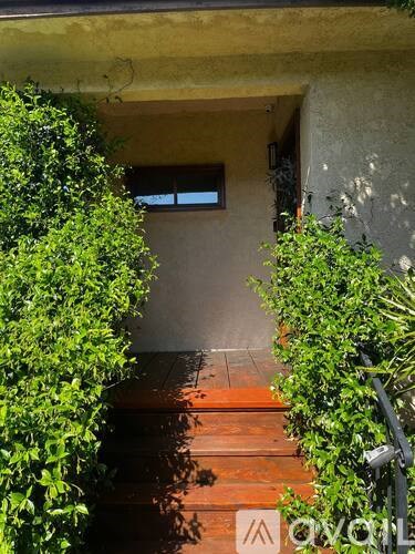 A small window is on the wall of a house.