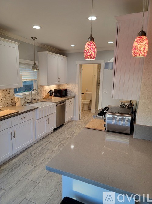 A kitchen with a countertop and cabinets.