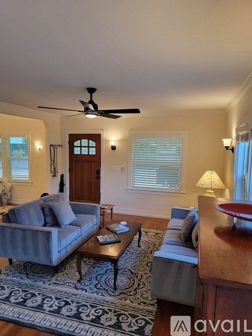 A staircase with a light switch on the wall.
