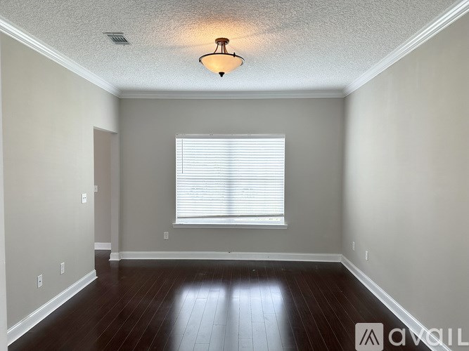 A dining room with a table set for two.