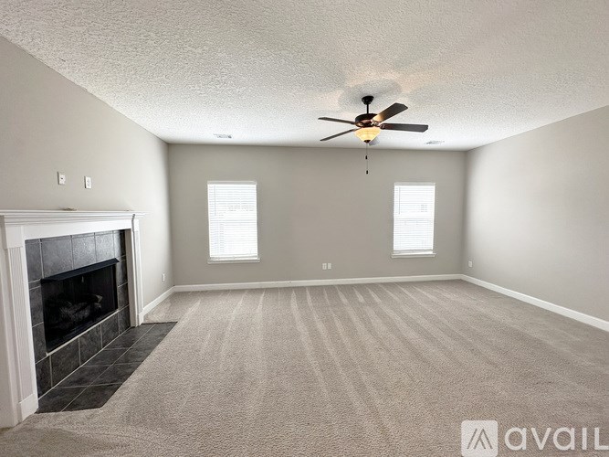 A kitchen with brown cabinets and a refrigerator.