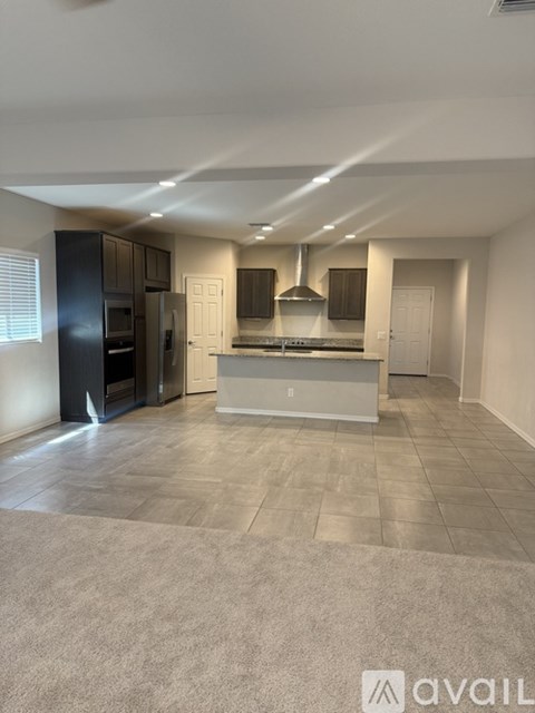A spacious kitchen with a large island in the middle.