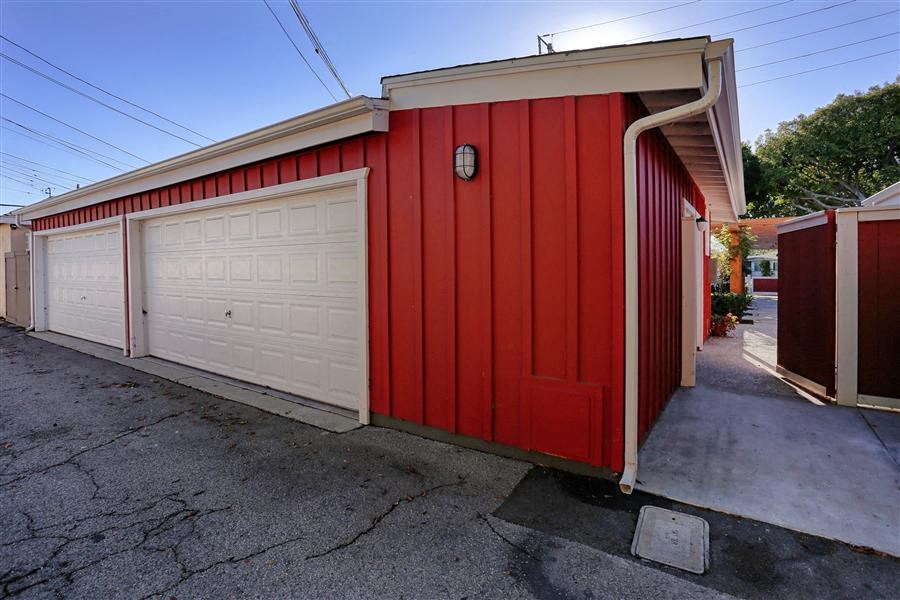 a red garage with a white garage door