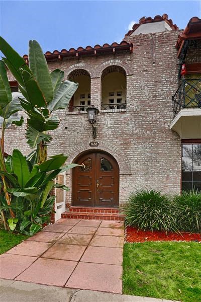 a brick house with a wooden door