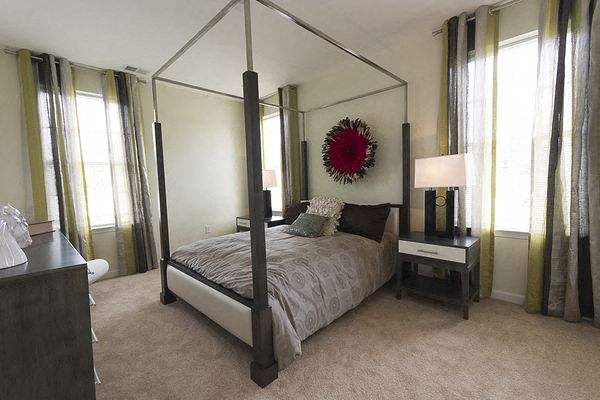 a bedroom with a four poster bed