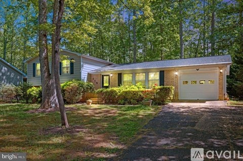 A house with a garage is available for sale.